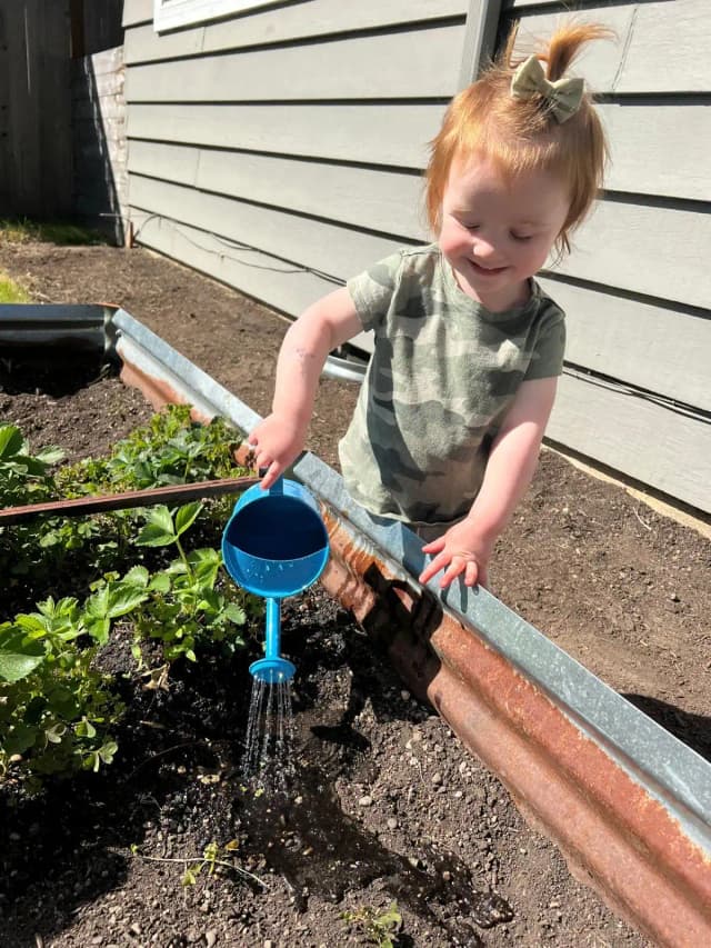 Girl watering plants