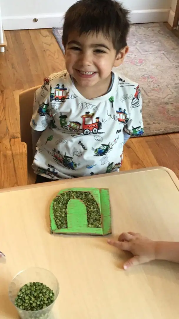  Child exploring green texture