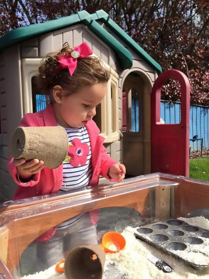  Child holding a piece of wood