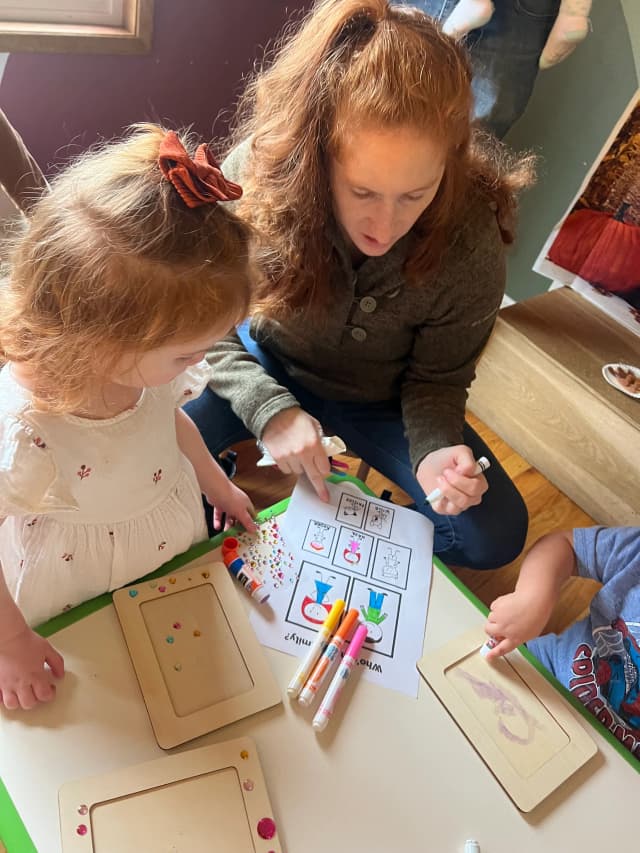  Child coloring with markers