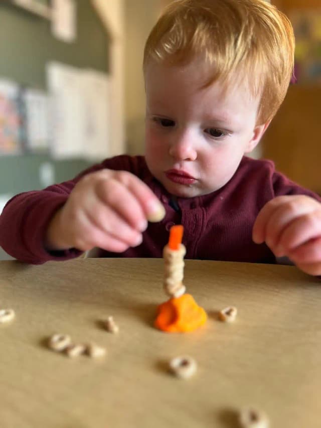  Child playing with modeling clay